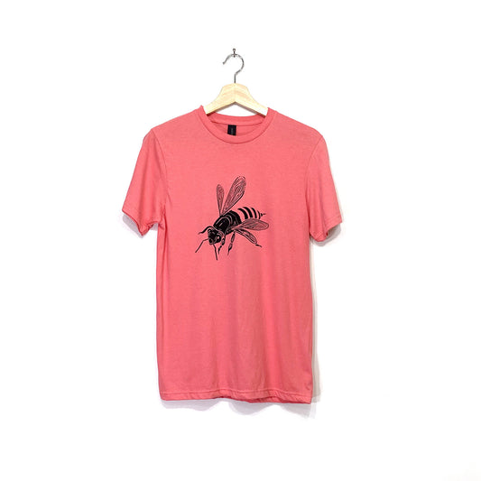 Coral coloured crew neck short sleeved t-shirt with a black bee screen printed on the chest