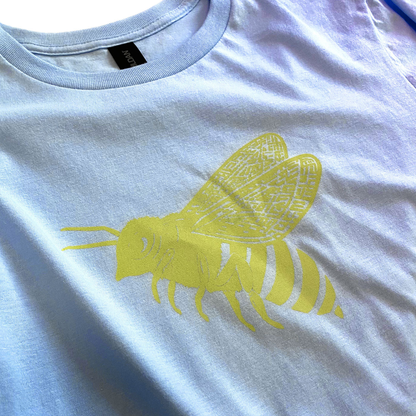 Bright Yellow Bee on Light Blue T-Shirt